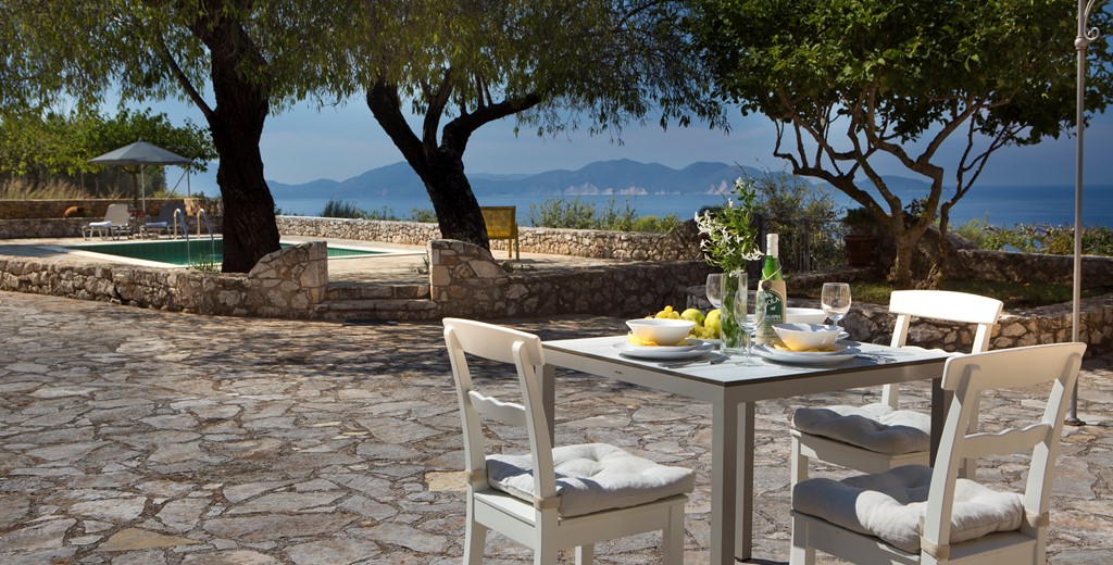 Light lunch in the sun with sea views outside Lemoni Cottage, Fiscardo, Kefalonia