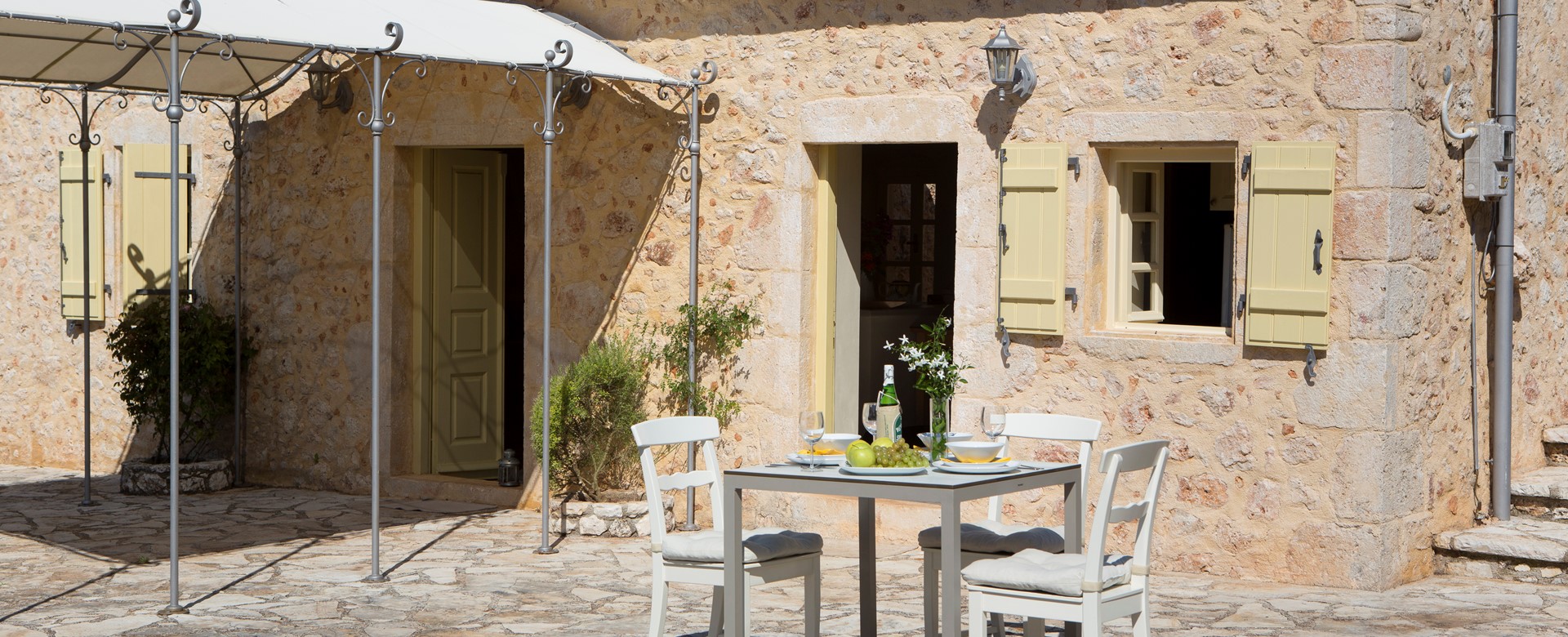 Afternoon fruit and wine closer to the cottage outside Lemoni Cottage, Fiscardo, Kefalonia