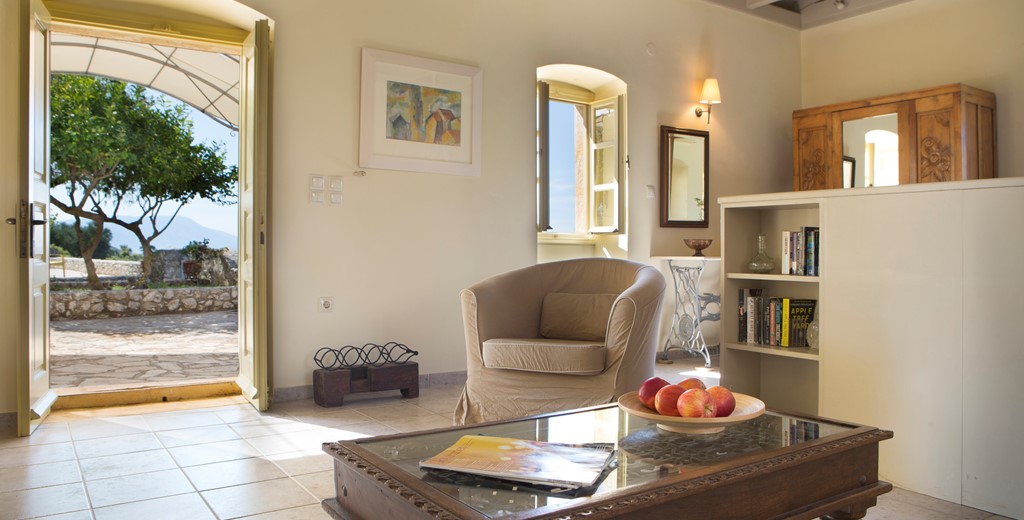 Tub chair with a view inside Lemoni Cottage, Fiscardo, Kefalonia