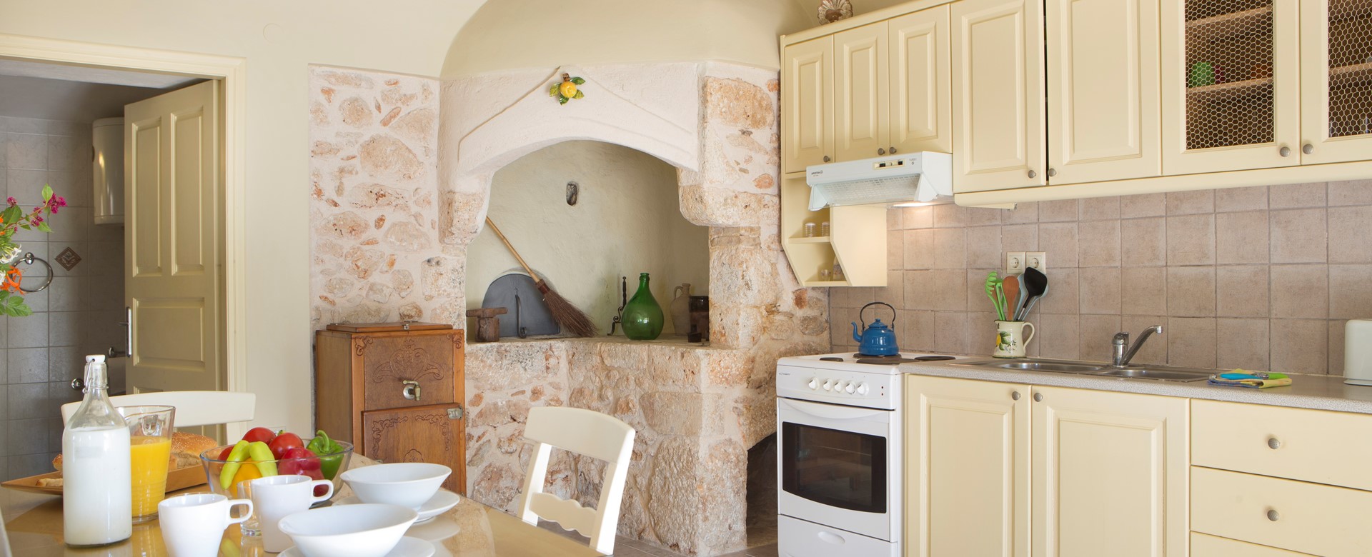 Dining and kitchen inside Lemoni Cottage, Fiscardo, Kefalonia