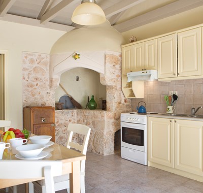 Dining and kitchen inside Lemoni Cottage, Fiscardo, Kefalonia