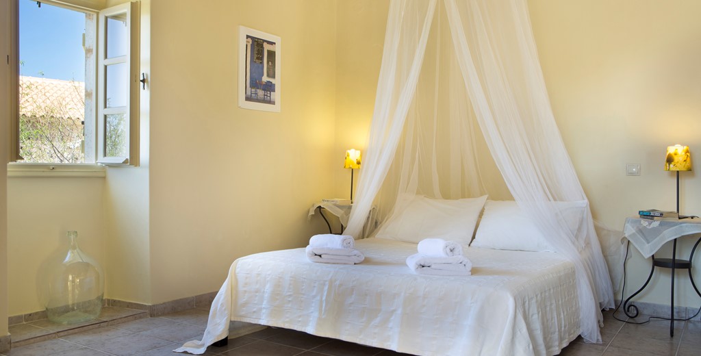 Master bedroom with king sized double bed perfect for a romantic holiday inside Lemoni Cottage, Fiscardo, Kefalonia