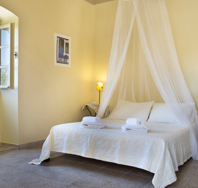 Master bedroom with king sized double bed perfect for a romantic holiday inside Lemoni Cottage, Fiscardo, Kefalonia