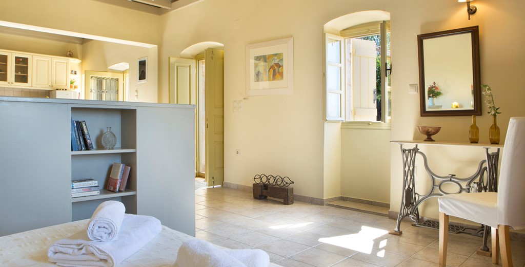 Open plan cottage interior with open ceiling space inside Lemoni Cottage, Fiscardo, Kefalonia