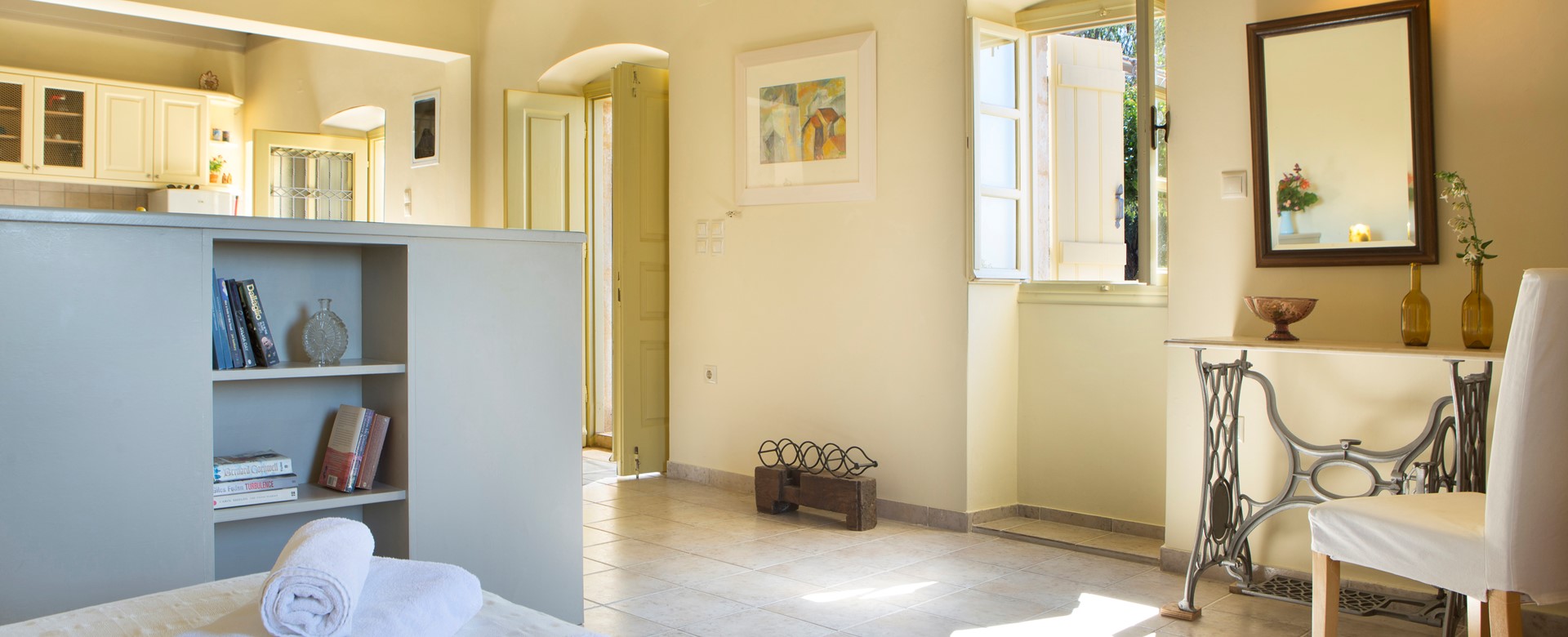 Open plan cottage interior with open ceiling space inside Lemoni Cottage, Fiscardo, Kefalonia