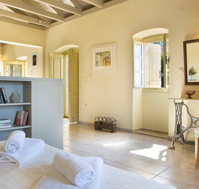 Open plan cottage interior with open ceiling space inside Lemoni Cottage, Fiscardo, Kefalonia