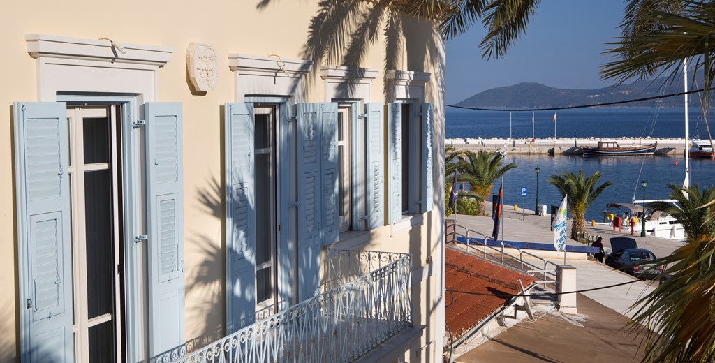 A view of the exterior balcony and views of Palm House Harbourfront Mansion, Agia Efimia, Kefalonia, Greek Islands