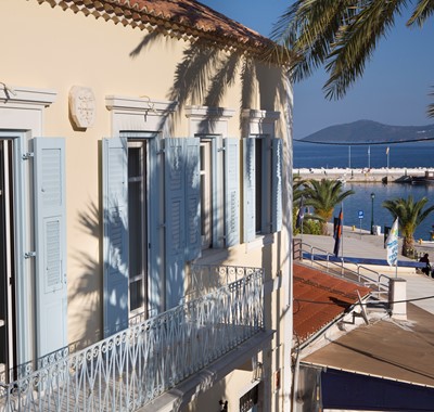 A view of the exterior balcony and views of Palm House Harbourfront Mansion, Agia Efimia, Kefalonia, Greek Islands