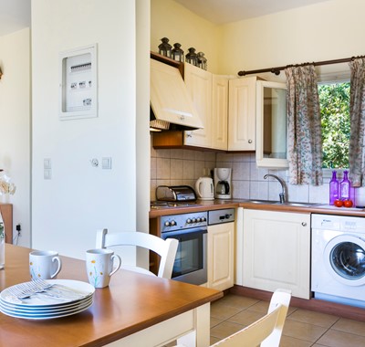 Fitted kitchen with washing machine has everything you need for a stay in Villa Cypress, Fiscardo, Kefalonia, Greek Islands