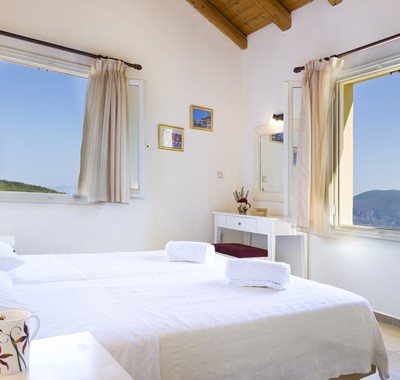 Bright clean and open bedroom space making the most of the views from Villa Cypress, Fiscardo, Kefalonia, Greek Islands