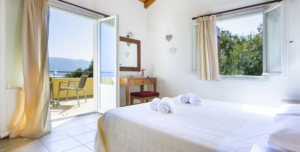 Spacious bedroom with king bed and private balcony in Villa Cypress, Fiscardo, Kefalonia, Greek Islands