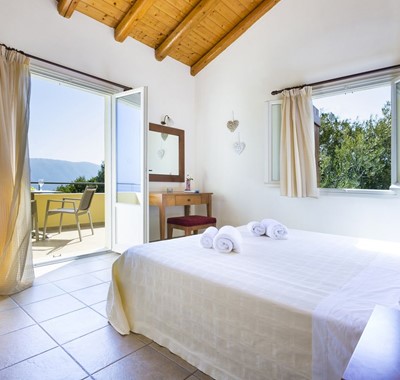 Spacious bedroom with king bed and private balcony in Villa Cypress, Fiscardo, Kefalonia, Greek Islands