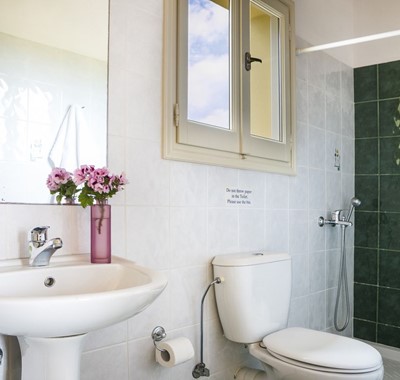Bathroom with shower over bath and basin Villa Cypress, Fiscardo, Kefalonia, Greek Islands