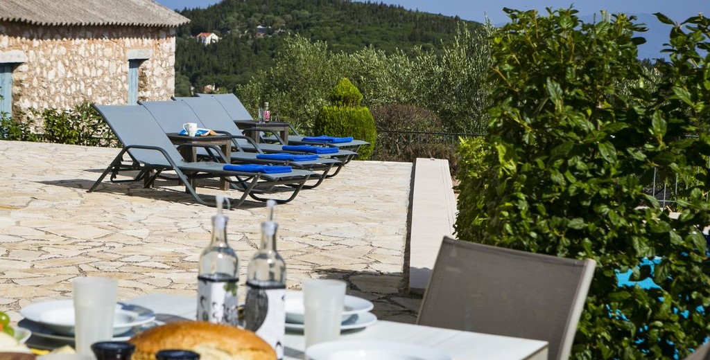 Take a break from the sunbathing with a mediteranean lunch by the pool at Villa Cypress, Fiscardo, Kefalonia, Greek Islands