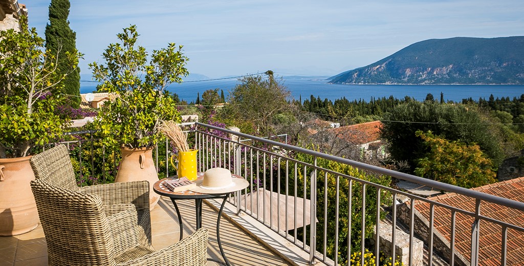 Enjoy a coffee or glass of wine as you unwind on holiday enjoying the views from the balcony of Villa Pelagia, Fiscardo, Kefalonia, Greek Islands