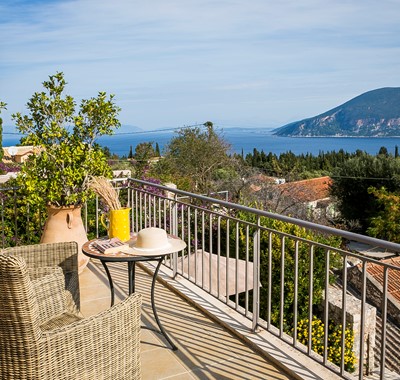 Enjoy a coffee or glass of wine as you unwind on holiday enjoying the views from the balcony of Villa Pelagia, Fiscardo, Kefalonia, Greek Islands