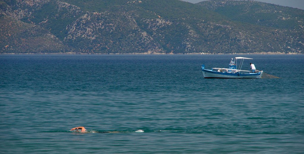 Watch the world go buy as you relax on the beachfront at Villa Frydi, Karavomilos, Kefalonia, Greek Islands
