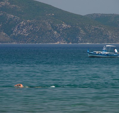 Watch the world go buy as you relax on the beachfront at Villa Frydi, Karavomilos, Kefalonia, Greek Islands