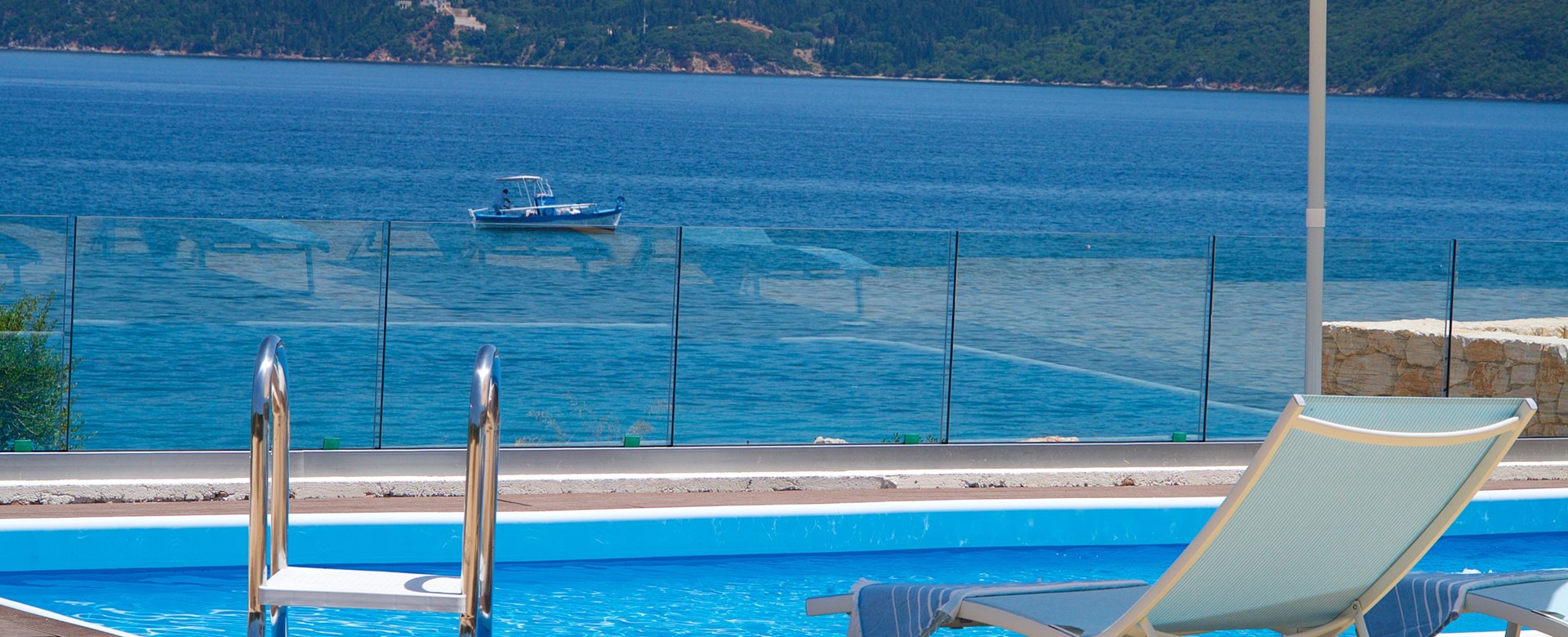 Watch the boats come and go from the pool side at Villa Frydi, Karavomilos, Kefalonia, Greek Islands