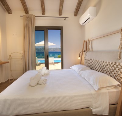 Comfortable large double bed with a view inside Villa Frydi, Karavomilos, Kefalonia, Greek Islands