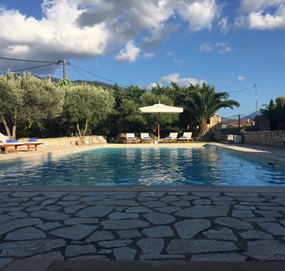 Evening sun around the pool at Casa Angela, Melissani Apartments, Karavomilos, Kefalonia, Greek Islands