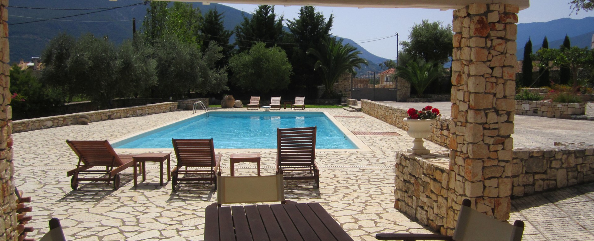 Pool, Mountians and sun make great relaxing holidays in Casa Angela, Melissani Apartments, Karavomilos, Kefalonia, Greek Islands