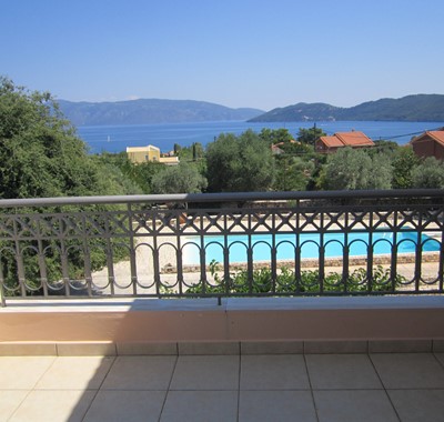 Balcony with a view of the pool, sea and coastline from Casa Angela, Melissani Apartments, Karavomilos, Kefalonia, Greek Islands