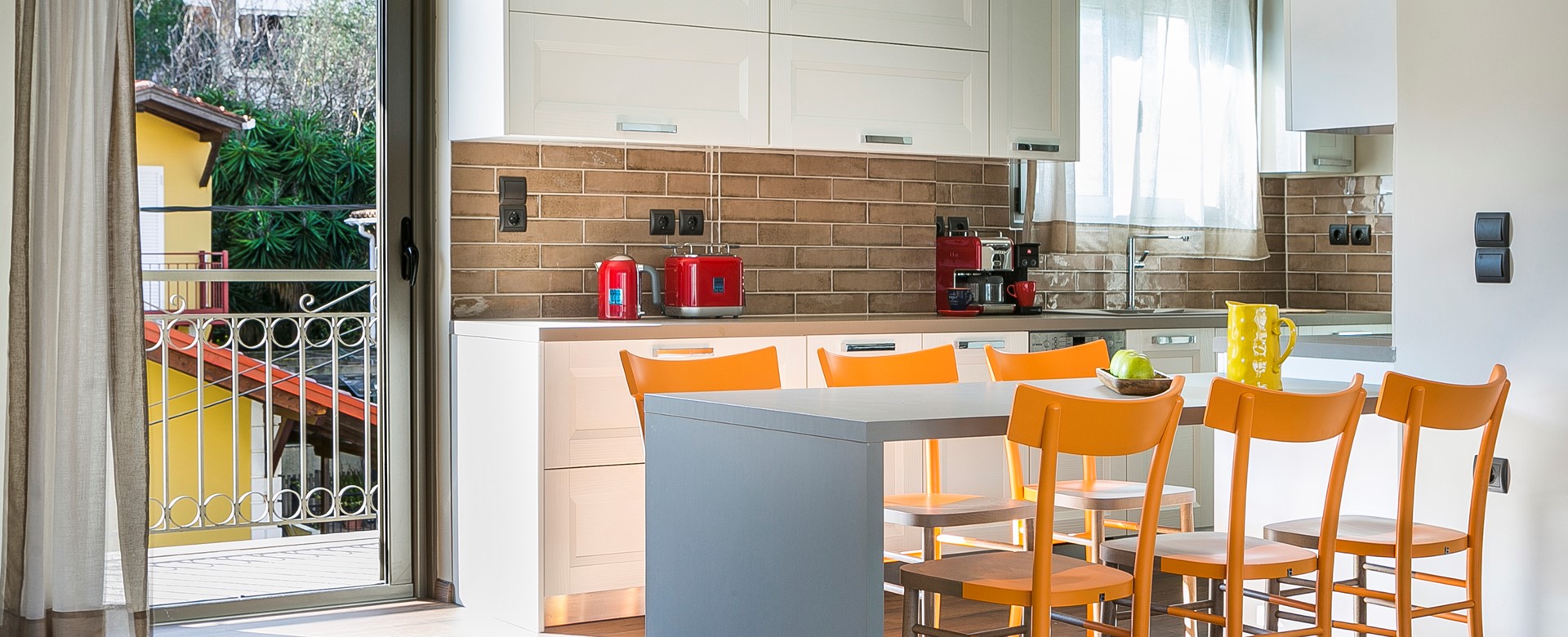 Breakfast bar along with the kitchen space to the rear of Marina Penthouse Apartment, Argostoli, Kefalonia, Greek Islands