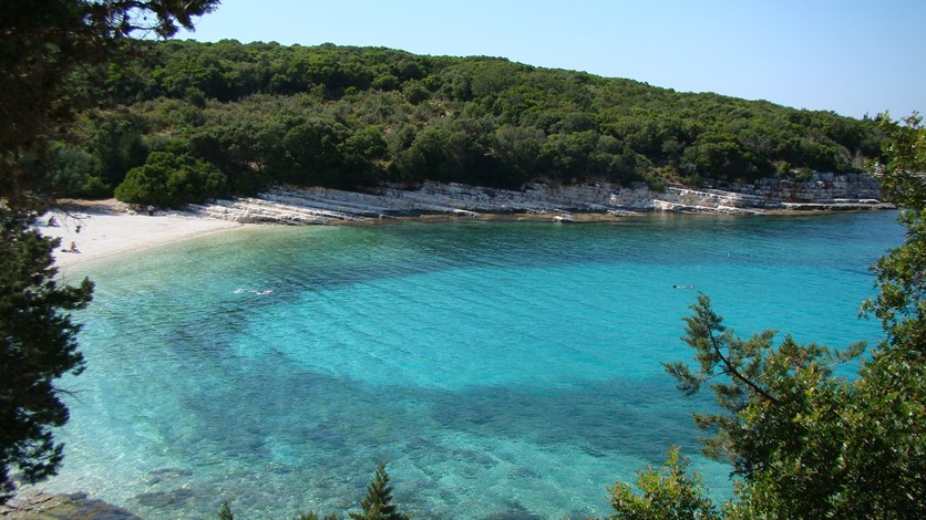 Crystal clear blue water Emblisi Beach, Fiscardo, Kefalonia, Greek Islands
