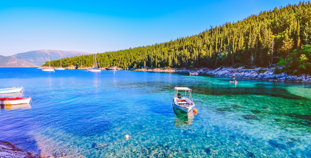 Calm and idyllic Beach of Foki Fiskardo with crystal clear and transparent water, Kefalonia, Ionian islands, Greece