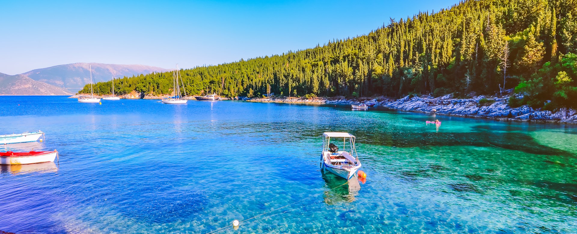 Calm and idyllic Beach of Foki Fiskardo with crystal clear and transparent water, Kefalonia, Ionian islands, Greece