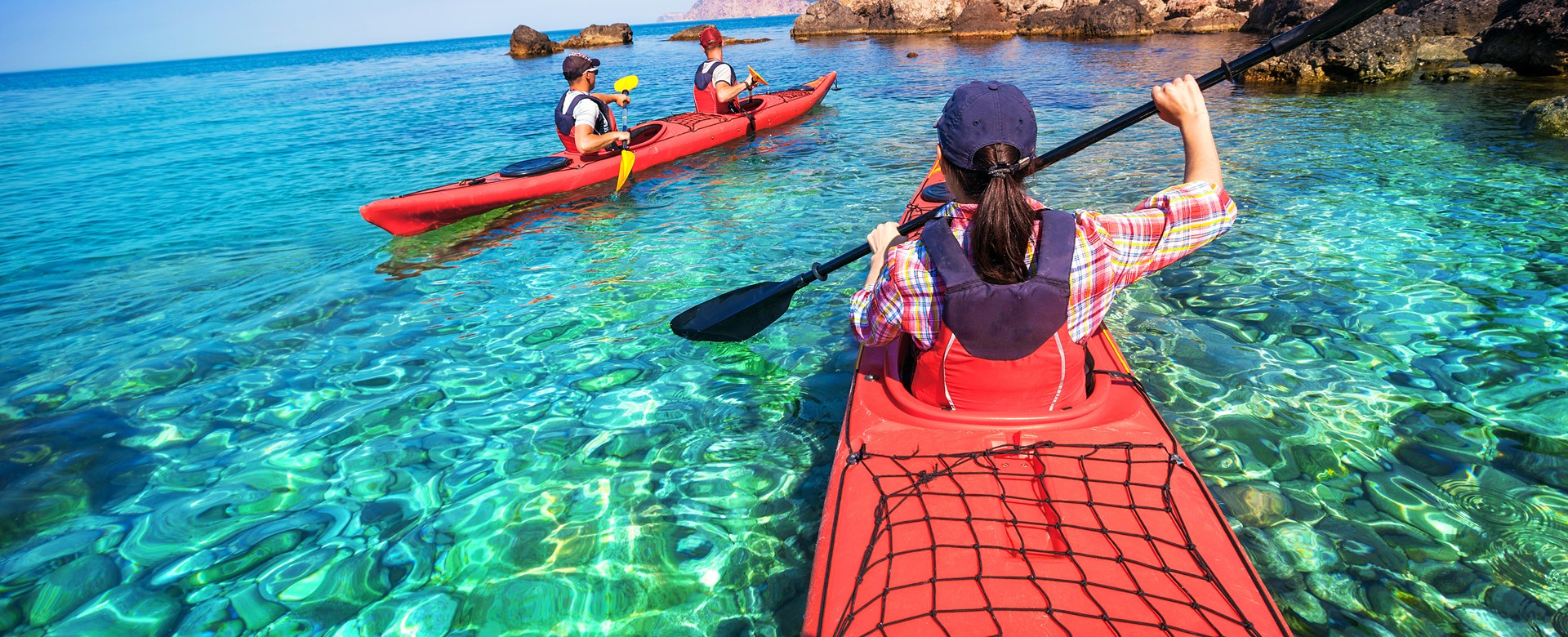 Sea Kayaking around the coast and crystal clear blue waters of Kefalonia, Greek Islands