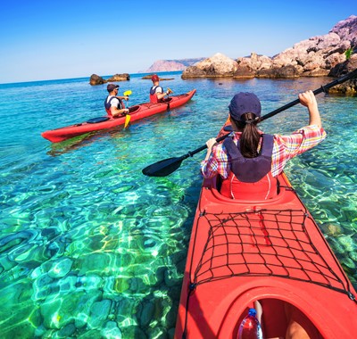 Sea Kayaking around the coast and crystal clear blue waters of Kefalonia, Greek Islands
